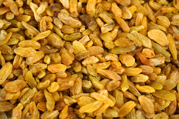  Long golden raisins as background