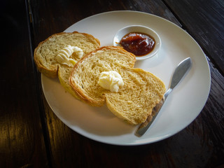 french toast with jam on a wooden table