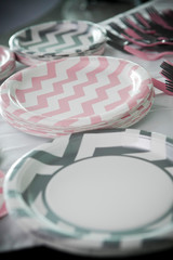 Pink and gray plates for party food