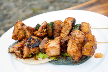 Chicken skewers fried in sesame oil, cuisine with oriental flavor in Guatemala, Central America.