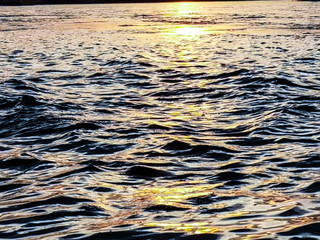 waves on beach at sunset