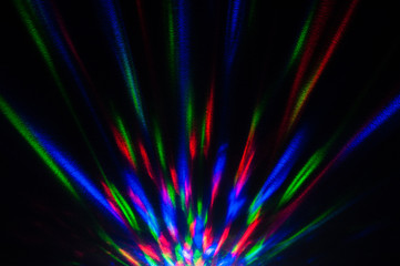 Disco ball projecting mix of colors all over wall