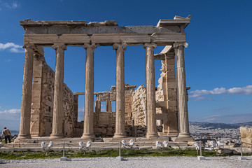 Obraz premium The Erechtheion (or Erechtheum, 406 BC) with Caryatids - ancient Greek temple on the north side of the Acropolis. Erechtheion dedicated to both Athena and Poseidon. Athens, Greece.