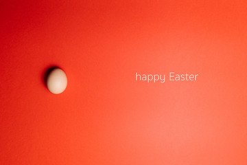 Fresh egg on a Red background. Happy Easter