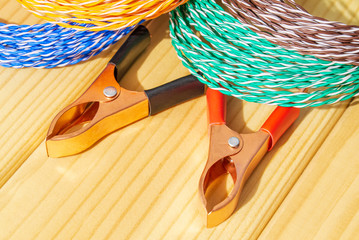 Multicolored wires and alligator clips prepared for master electrician