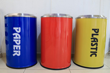 Yellow, Red and Blue recycle bins. Interior recycling bins.