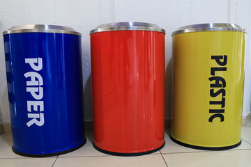 Yellow, Red and Blue recycle bins. Interior recycling bins.