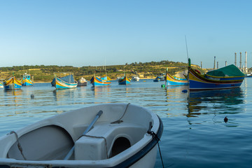 A luzzu is a traditional fishing boat from the Maltese islands. Painted in bright colours, luzzus have existed sin