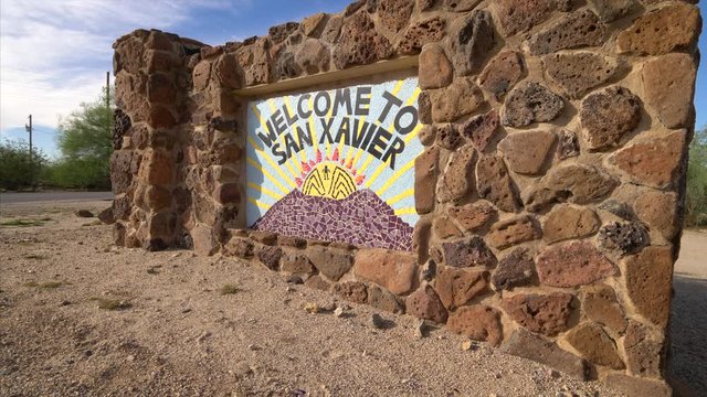 Tile sign at entrance to San Xavier del Bac historic Spanish Mission Church in Tucson, Arizona