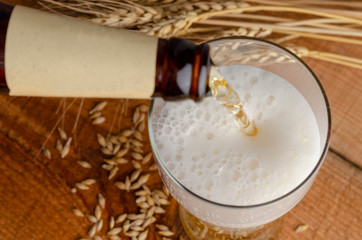 Bretzels and beer on wooden background. Oktoberfest food