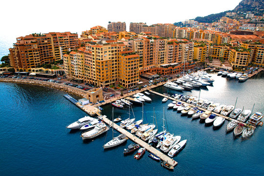 Monaco aerial view. Mediterranean sea blue waters. A lot of little yachts in the port. 