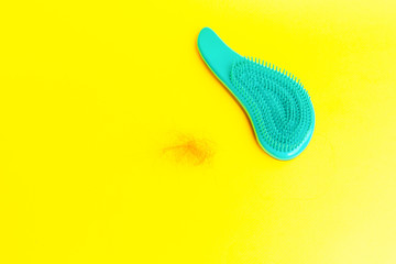 girl with a comb and problem hair on white background