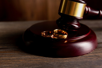 Judge gavel deciding on marriage divorce.