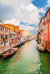 View of a characteristic Venice canal and old traditional houses in the quiet Cannareggio District