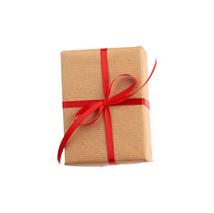 rectangular box wrapped in brown paper and tied with a red bow,