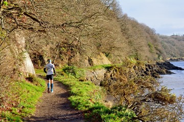 Obraz premium Jogger along the river at Lannion in Brittany. France