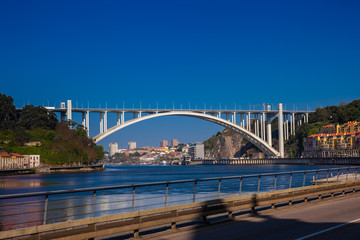 View of the Douro River and the Arrabida Bridge in a beautiful early spring day at Porto City in...