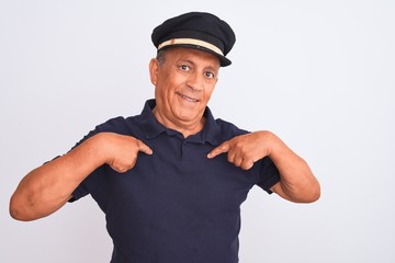 Senior grey-haired man wearing black polo and captain hat over isolated white background looking...