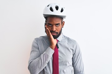 African american businessman with braids wearing bike helmet over isolated white background thinking looking tired and bored with depression problems with crossed arms.