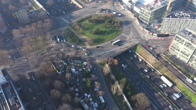Homeless migrants in Paris aerial shot ring road traffic pollution