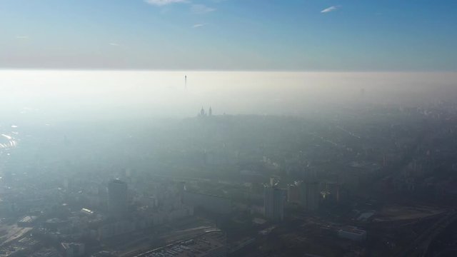 Fog pollution over Paris greenhouse gas Eiffel tower and Montparnasse France capital 