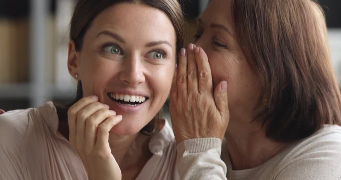 Funny two age generations women family share secrets gossip