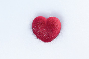 Red heart on the snow. Valentines day concept