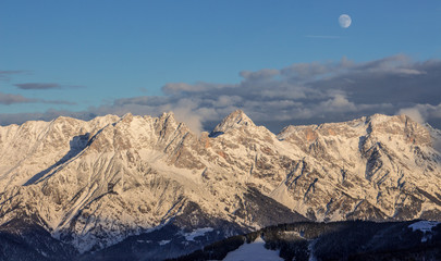 Lonely person portrait and Mountain Birnhorn Saalbach sunset summit cross