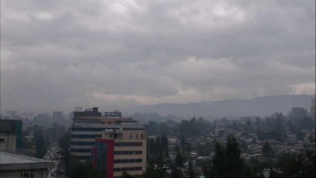 Time laps for arat kilo in Addis Ababa in Ethiopia, raging clouds is moving fast with street showing cars.