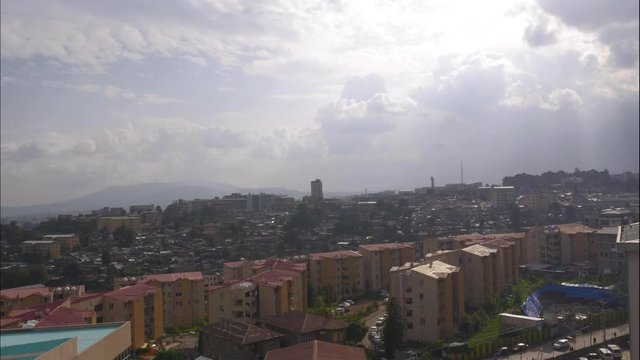 Time laps for piassa area in Addis ababa in Ethiopia, with God rays passing through the thick clouds.