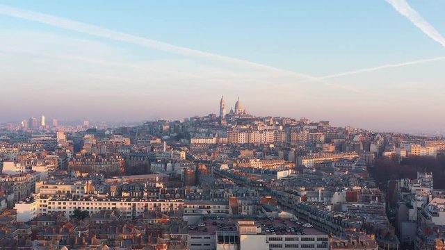 Paris rooftops aerial sunset with the Basilica of the Sacred Heart pollution aerial shot 