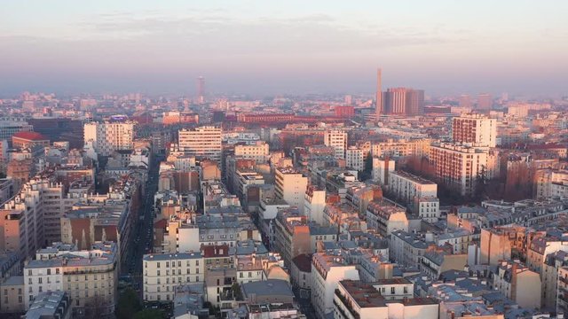 Paris sunset aerial shot Bichat Hospital chimney rooftops view polluted sky France