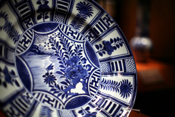 Beautiful blue-and-glaze dish, full of Eastern and Western totem elements