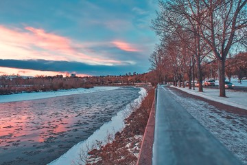 Sunset Over A Winter City River