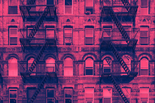 Colorful old pink and blue buildings in the East Village neighborhood of Manhattan in New York City