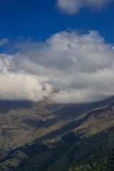 Fototapeta premium Snow-covered Mountain With Blue Sky, Cloud and Fog
