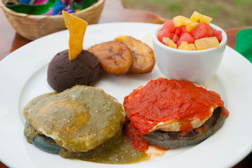  Dish served for breakfast in Guatemala, traditional and organic outdoors on wooden table, nutrition, calories and protein to start the day.
