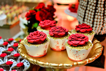 cupcakes with red  flowers, candy table