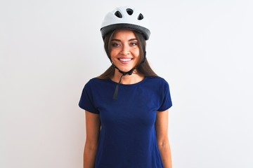 Young beautiful cyclist woman wearing security bike helmet over isolated white background with a happy and cool smile on face. Lucky person.