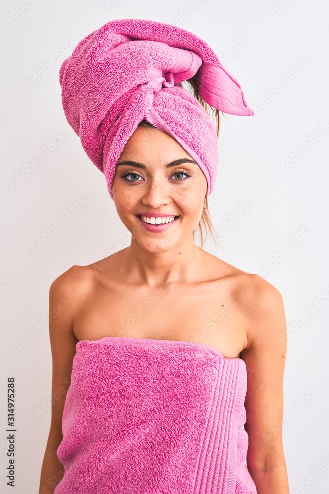 Wall mural Young beautiful woman wearing shower towel after bath over isolated white background with a happy face standing and smiling with a confident smile showing teeth - Wall murals