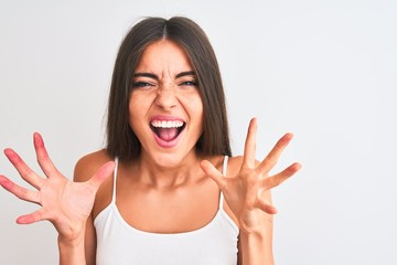 Young beautiful woman wearing casual t-shirt standing over isolated white background very happy and excited, winner expression celebrating victory screaming with big smile and raised hands