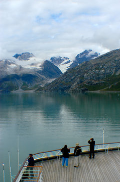 Entering Glacier Bay from a cruise ship as people take pictures and photos of the glaciers.  