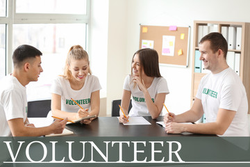 Team of young volunteers at meeting