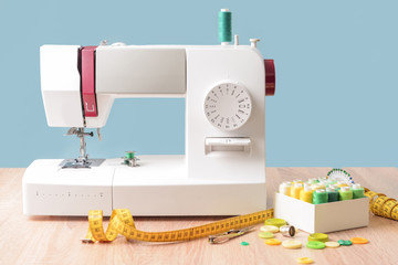 Sewing machine with supplies on table