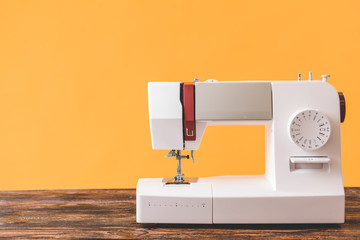 Sewing machine on wooden table