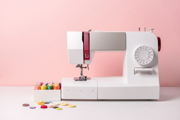 Sewing machine with supplies on table