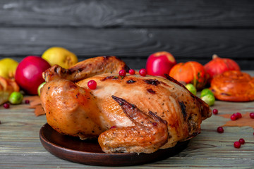 Tasty baked turkey for Thanksgiving day on table