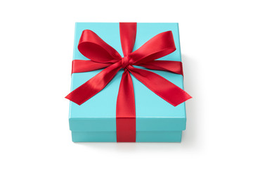 赤いリボンをかけた青緑色のプレゼントボックス