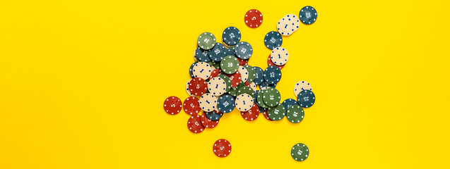 top view bunch of poker chips drop on colorful table, winning the holdem in casino, minimalist