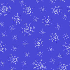 Seamless pattern of snowflakes on a blue background